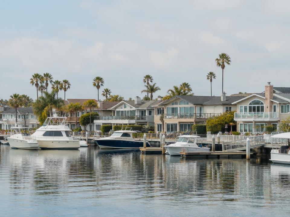 Waterfront homes and boats along the Newport Beach harbor